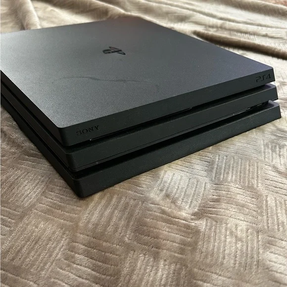 PS4 Pro + Controller + Power Cord + HDMI Cord + 2 Games